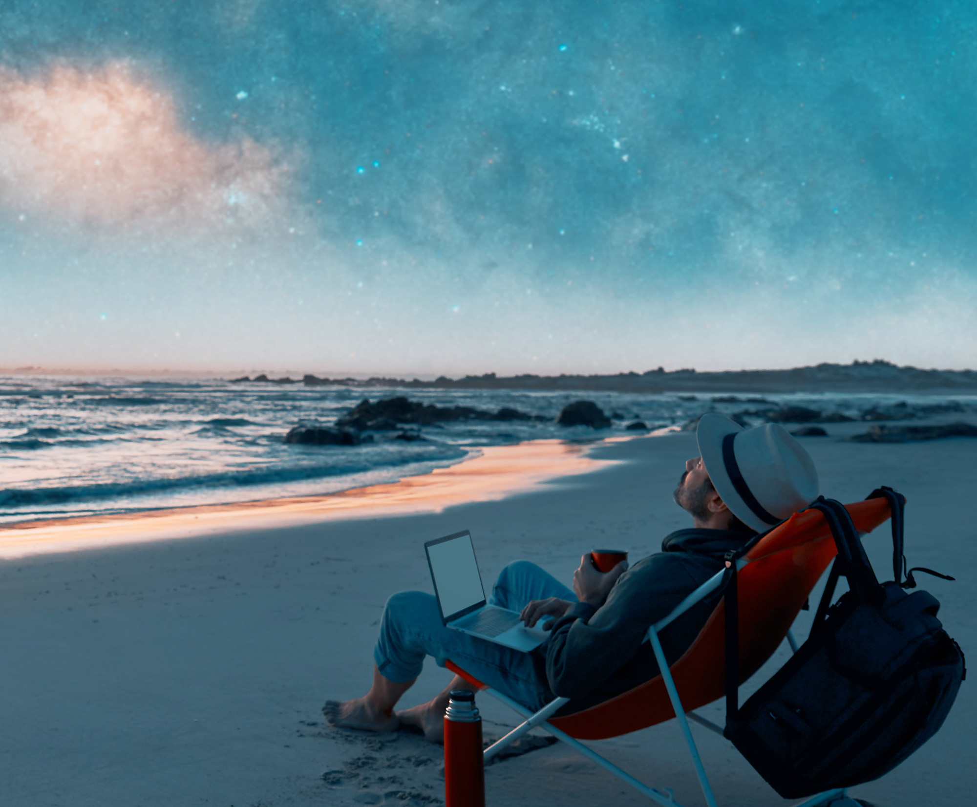 Person at the beach looking at the stars